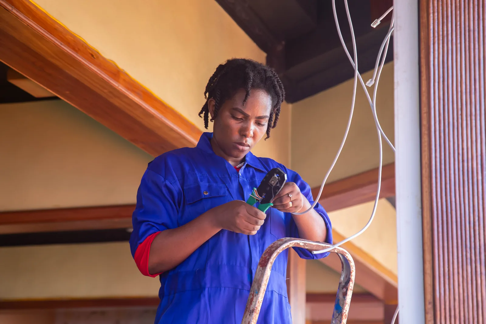 Terminating a cable from a step ladder, for electrician services in Hartford