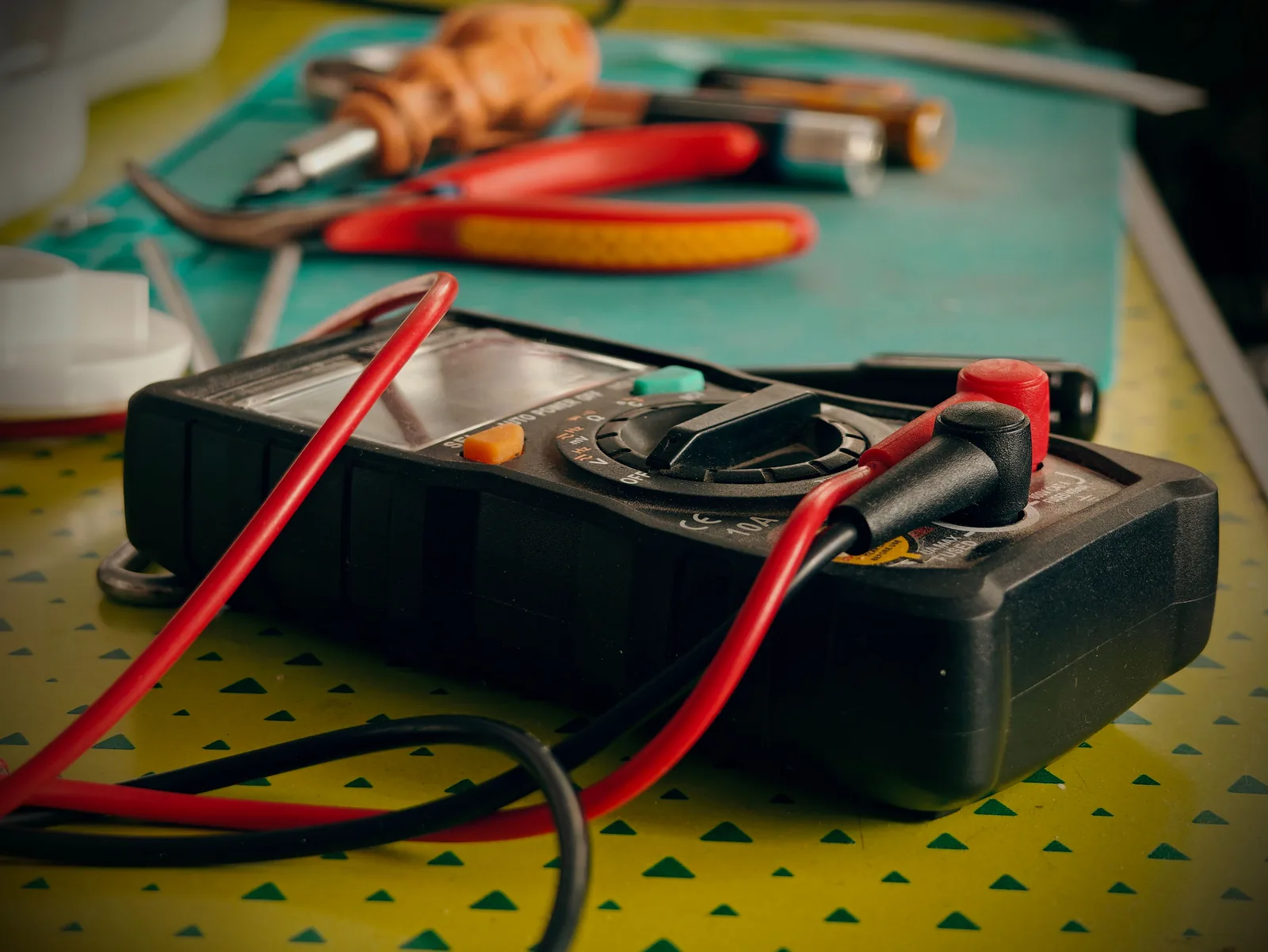 A multimeter and hand tools ready for a diagnostic visit, for electrician in Hartford