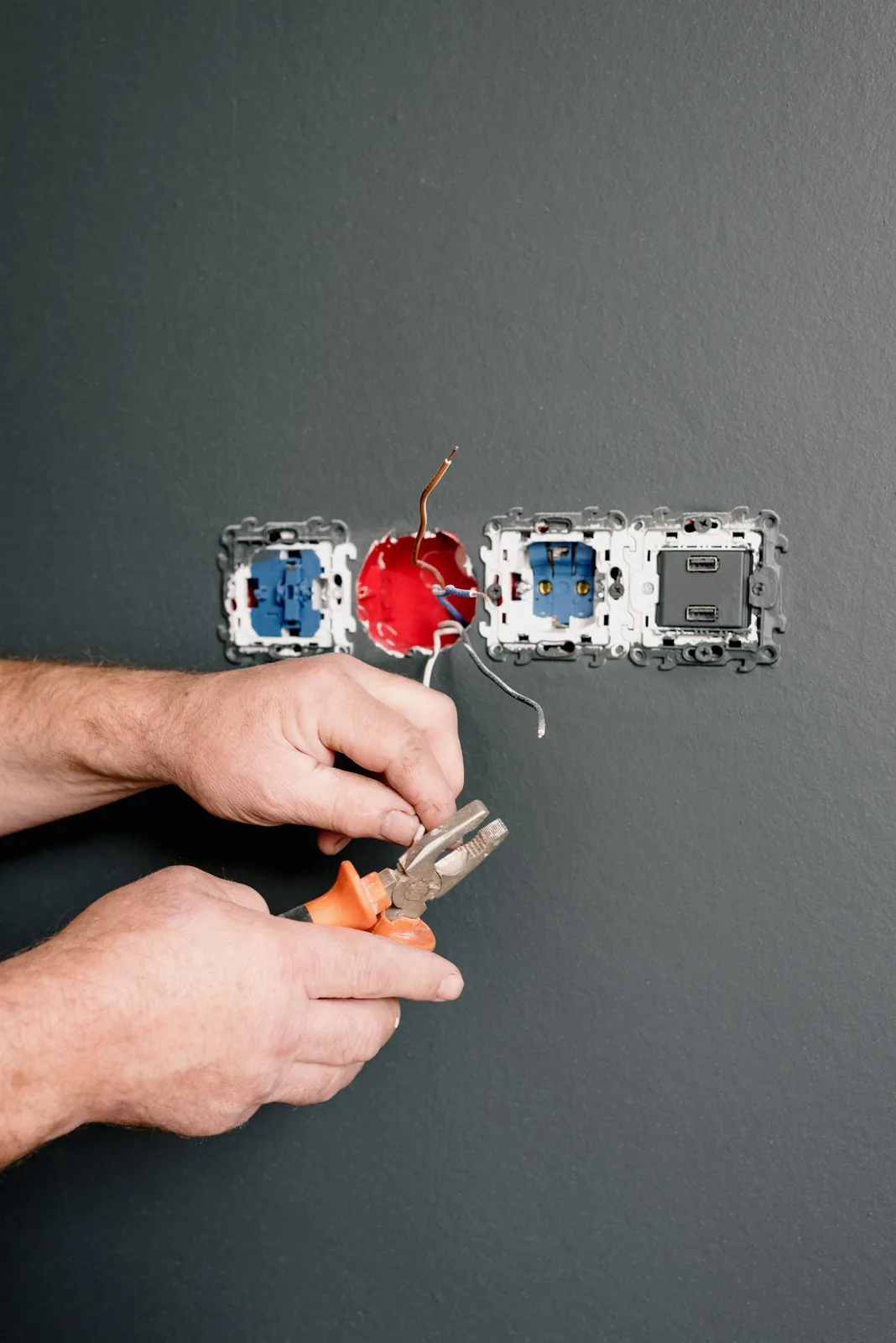 Wiring an outlet box into a finished wall, for code violation in Hartford