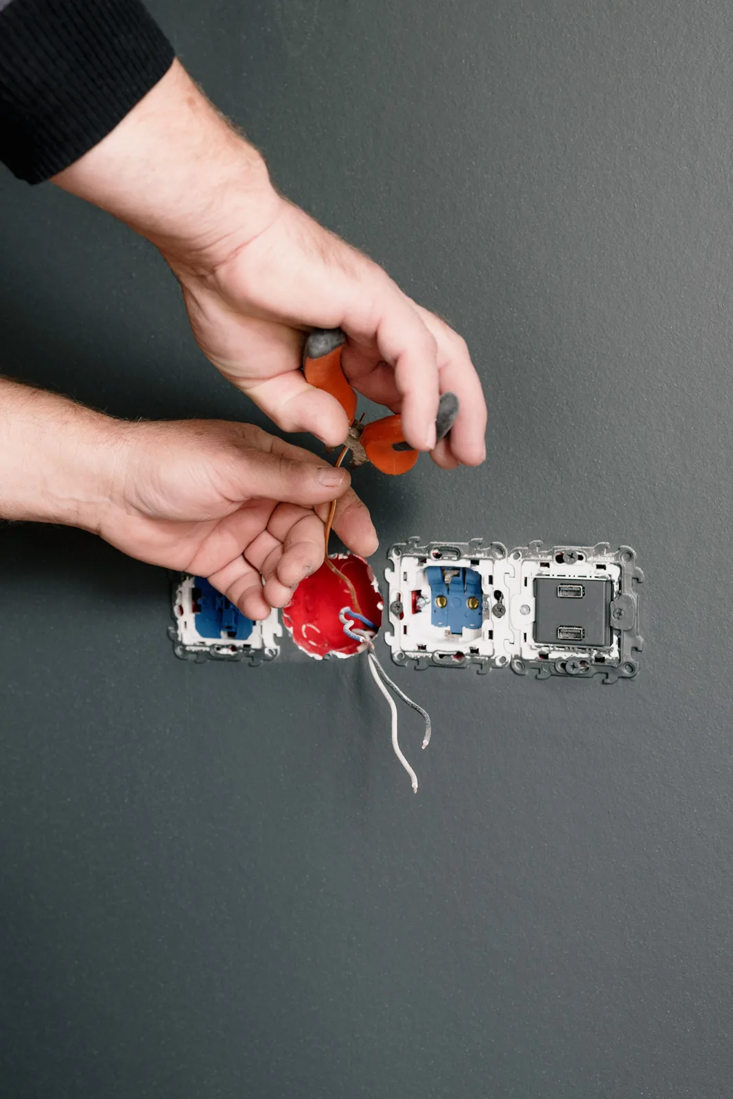 Stripping conductors at an outlet box, for outlet installation in Hartford