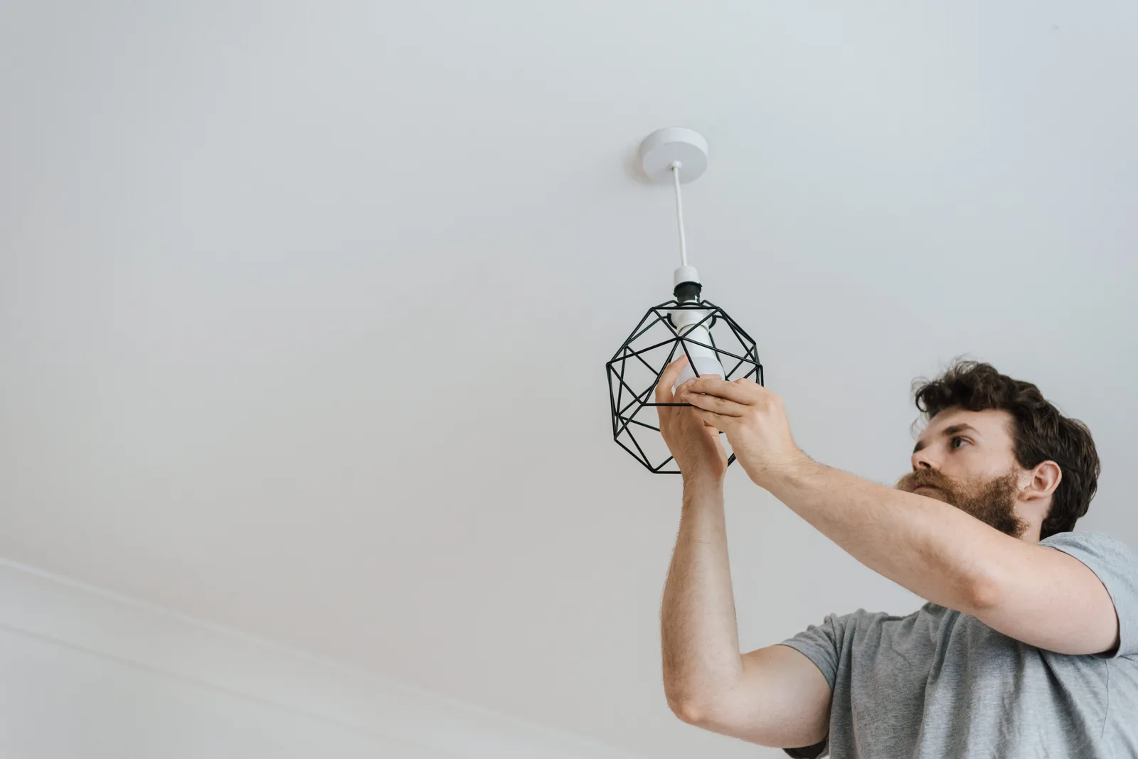 Fitting a lamp into a pendant fixture, for ev charger installation in Hartford